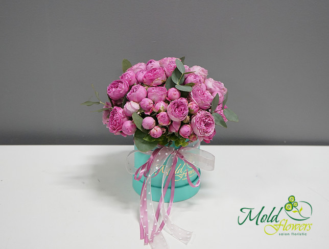 Box with pink peony-style roses photo